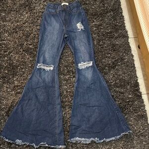 Vibrant Blue Flare Wide Leg Jeans with Distressed Details